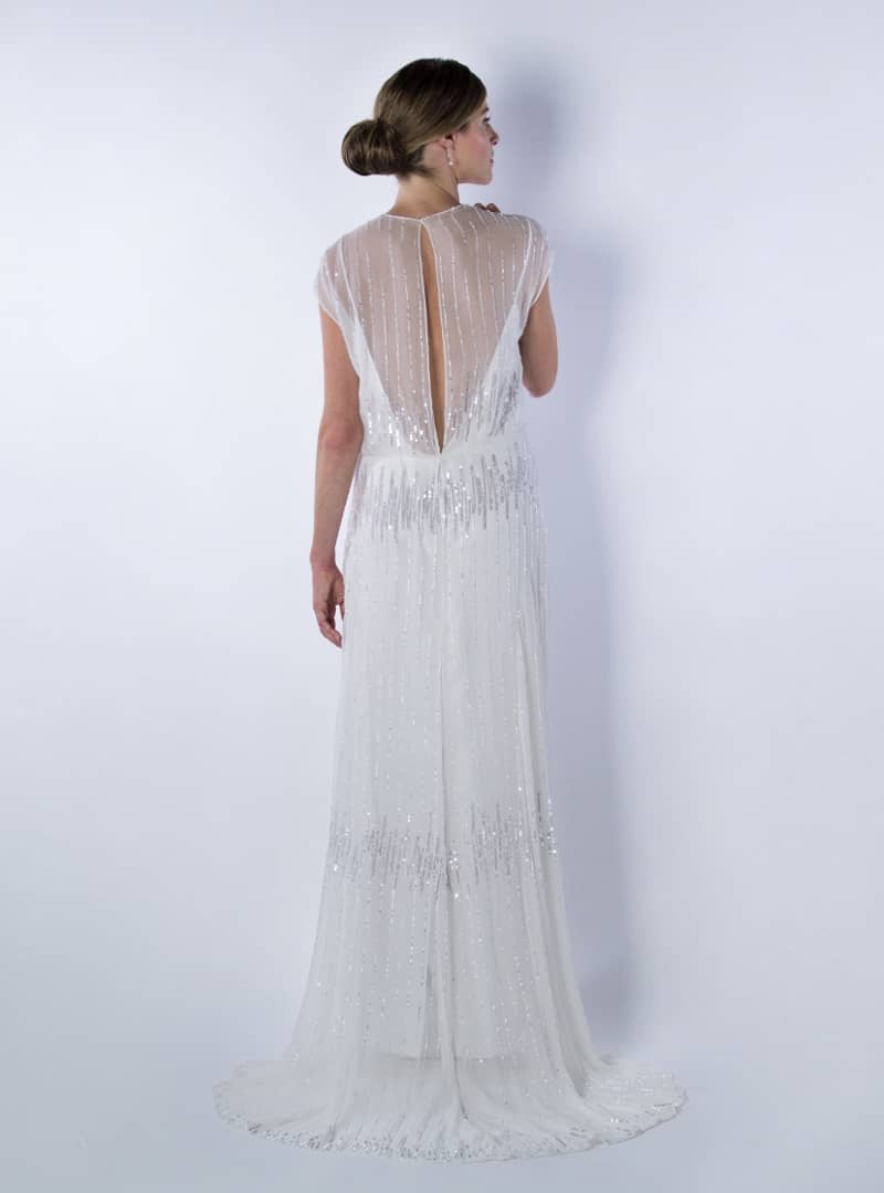 Greta es un diseño de vestido de  novia de CRISTINA SAURA. Destaca la atractiva transparencia en su espalda.