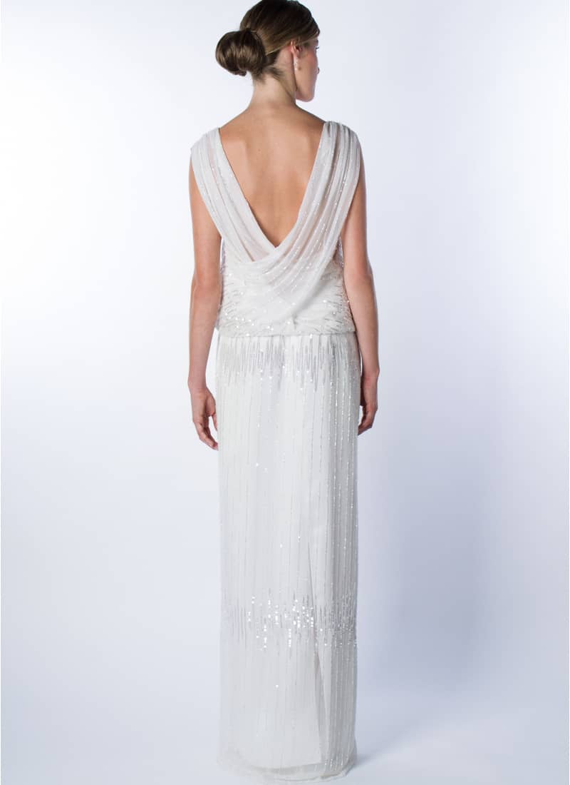 Subtil elegància i feminitat expressa aquest disseny original per vestit de núvia Alta Costura que signa CRISTINA SAURA.